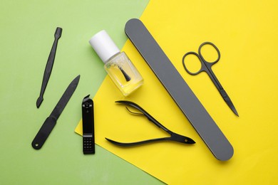 Photo of Set of pedicure tools on color background, flat lay