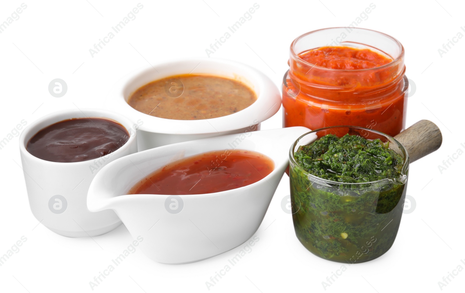 Photo of Different marinades in tableware isolated on white