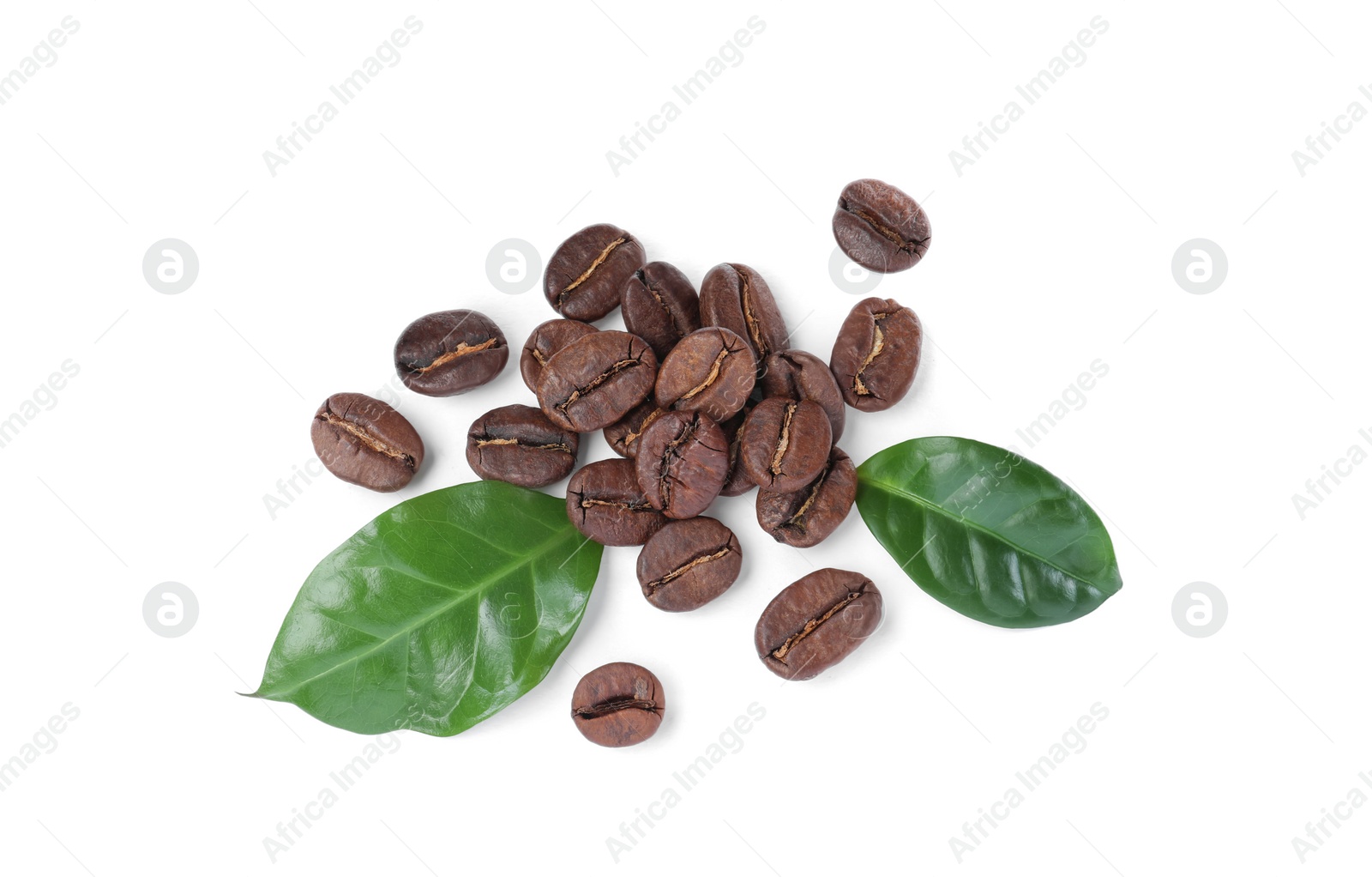 Photo of Roasted coffee beans with fresh leaves on white background, top view