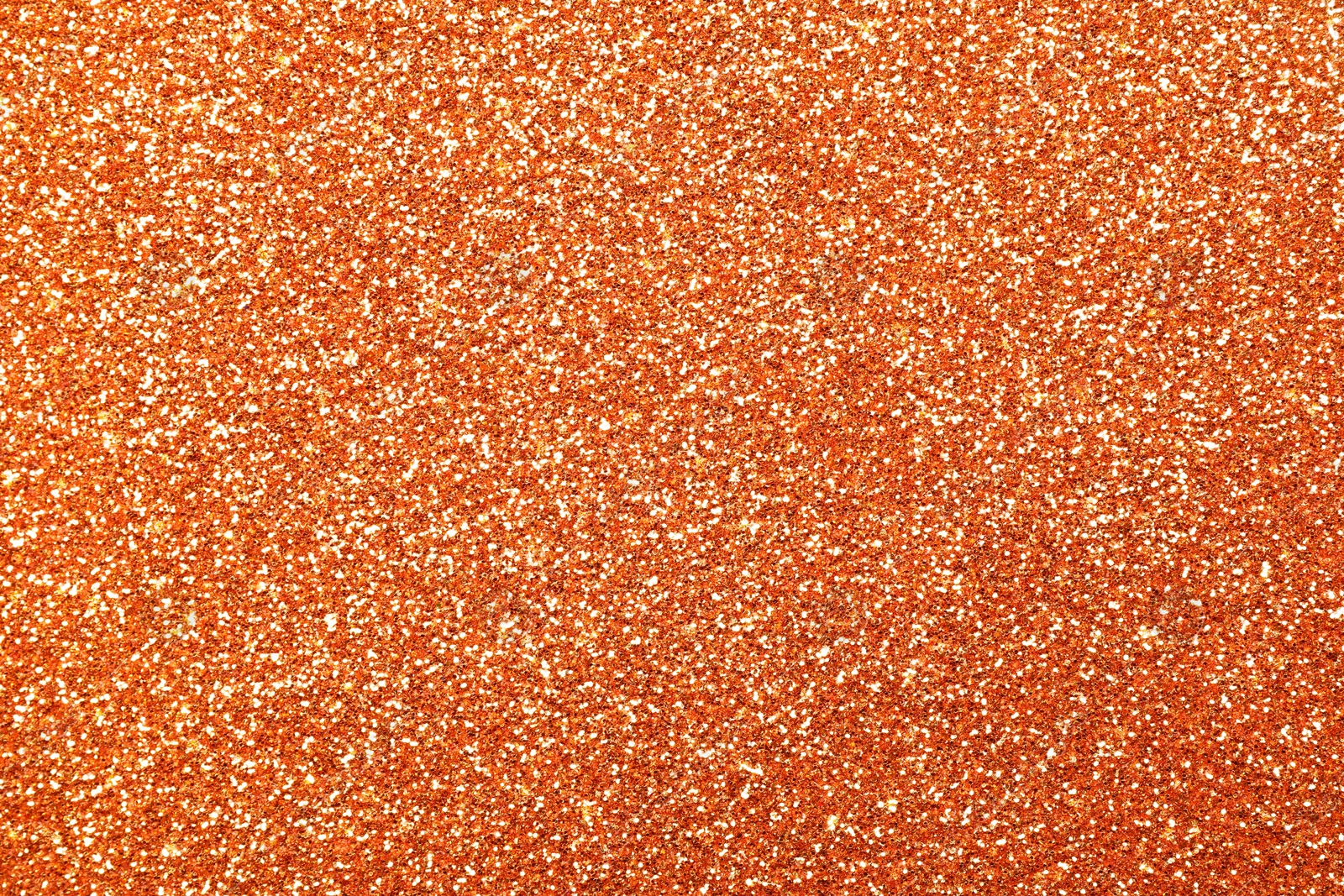 Image of Beautiful shiny orange glitter as background, closeup