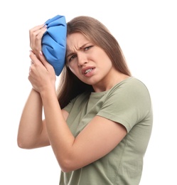 Photo of Unhappy woman using cold pack to cure headache on white background