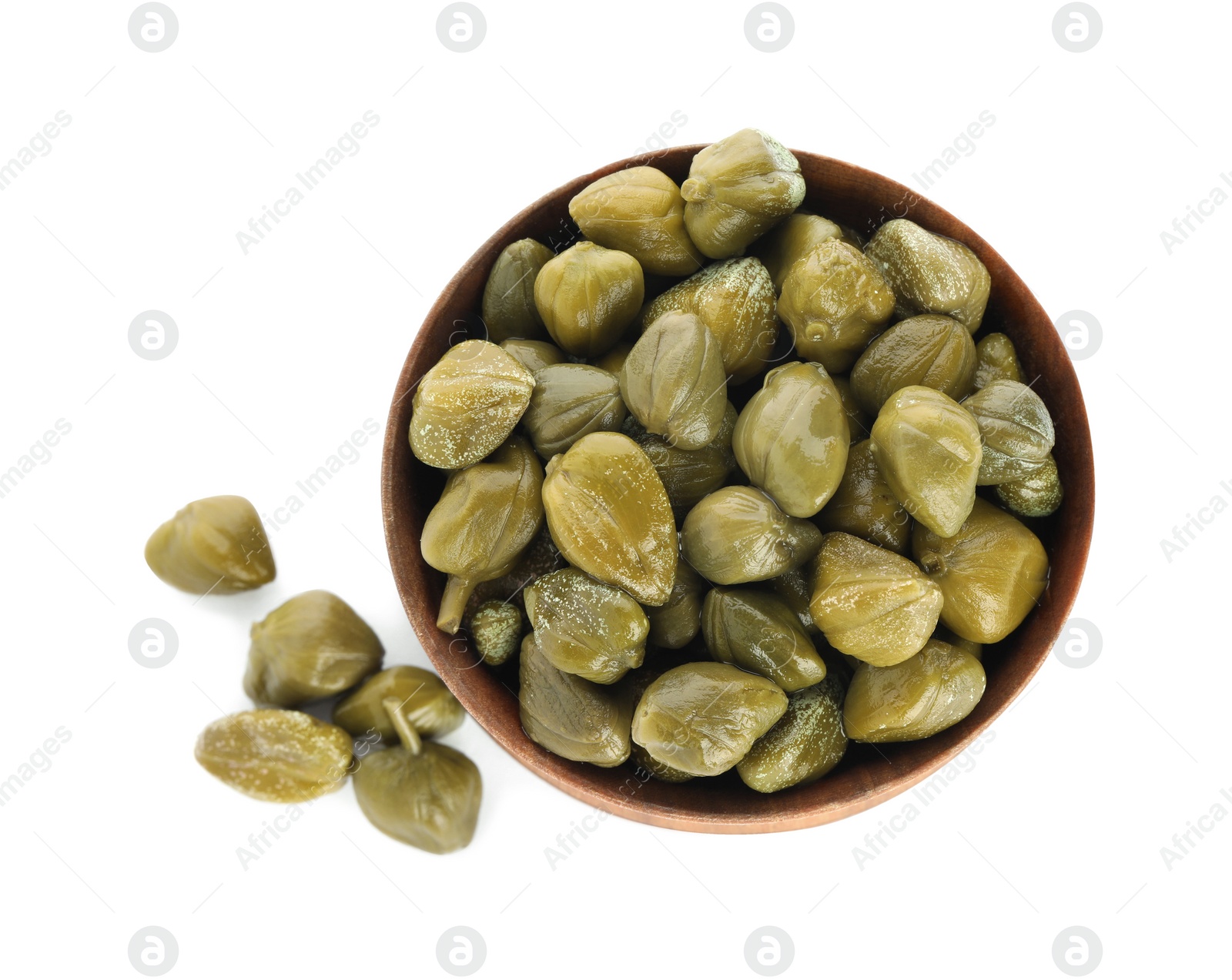 Photo of Capers and bowl isolated on white, top view