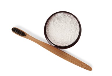 Jar of tooth powder and brush on white background, top view