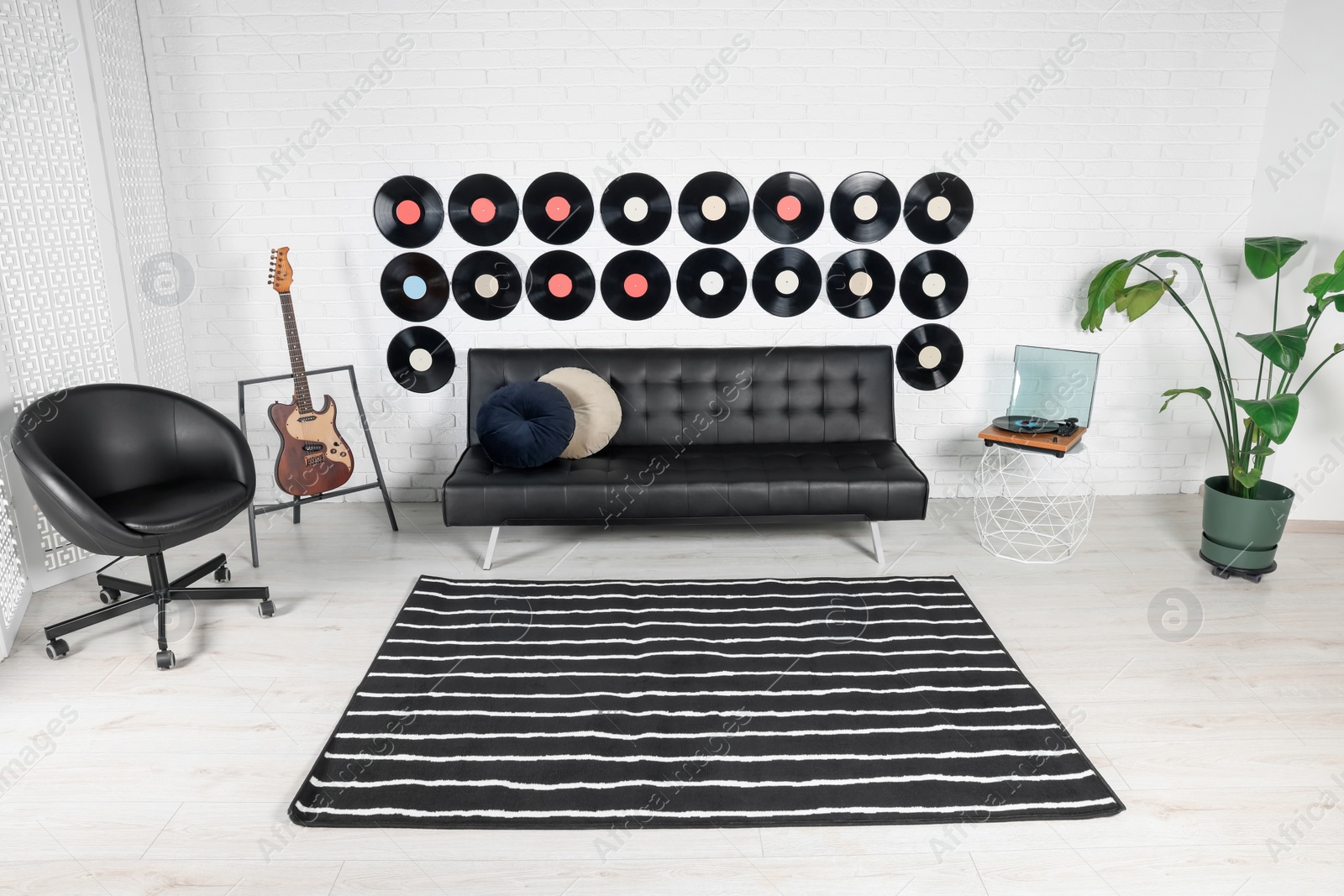 Photo of Living room decorated with vinyl records. Interior design