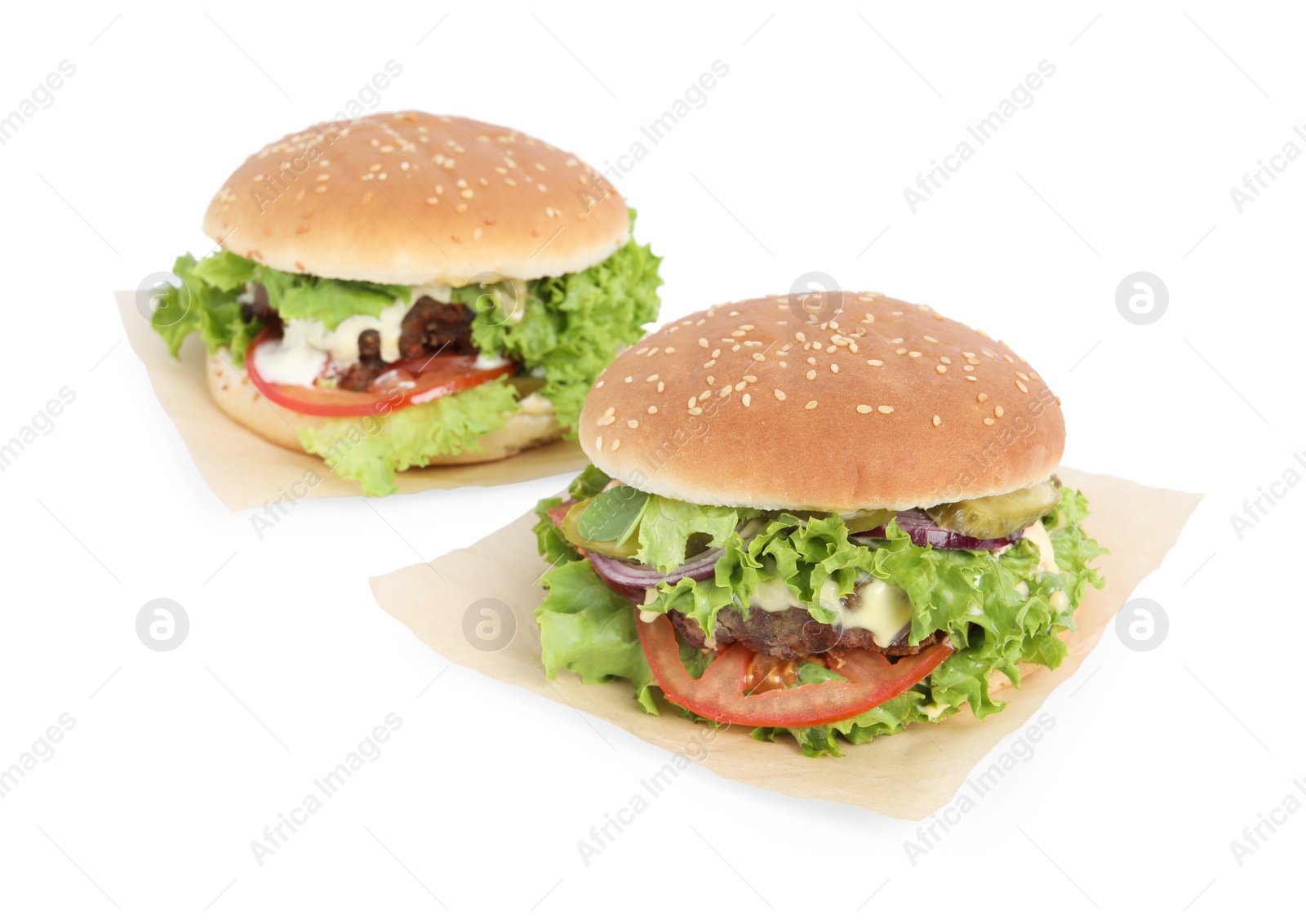 Photo of Delicious burgers with beef patty and lettuce isolated on white