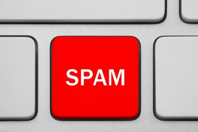 Image of Red button with word Spam on computer keyboard, top view