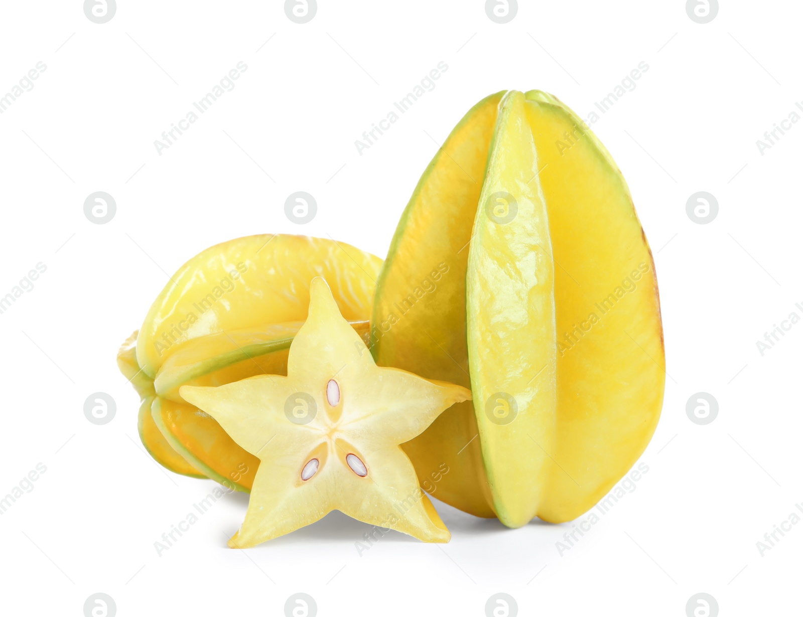 Photo of Cut and whole carambolas on white background