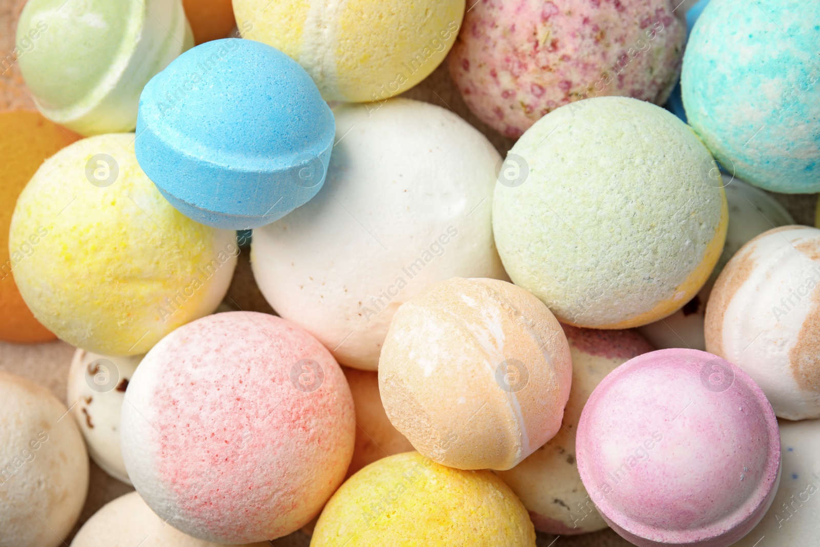 Photo of Many bath bombs as background, top view