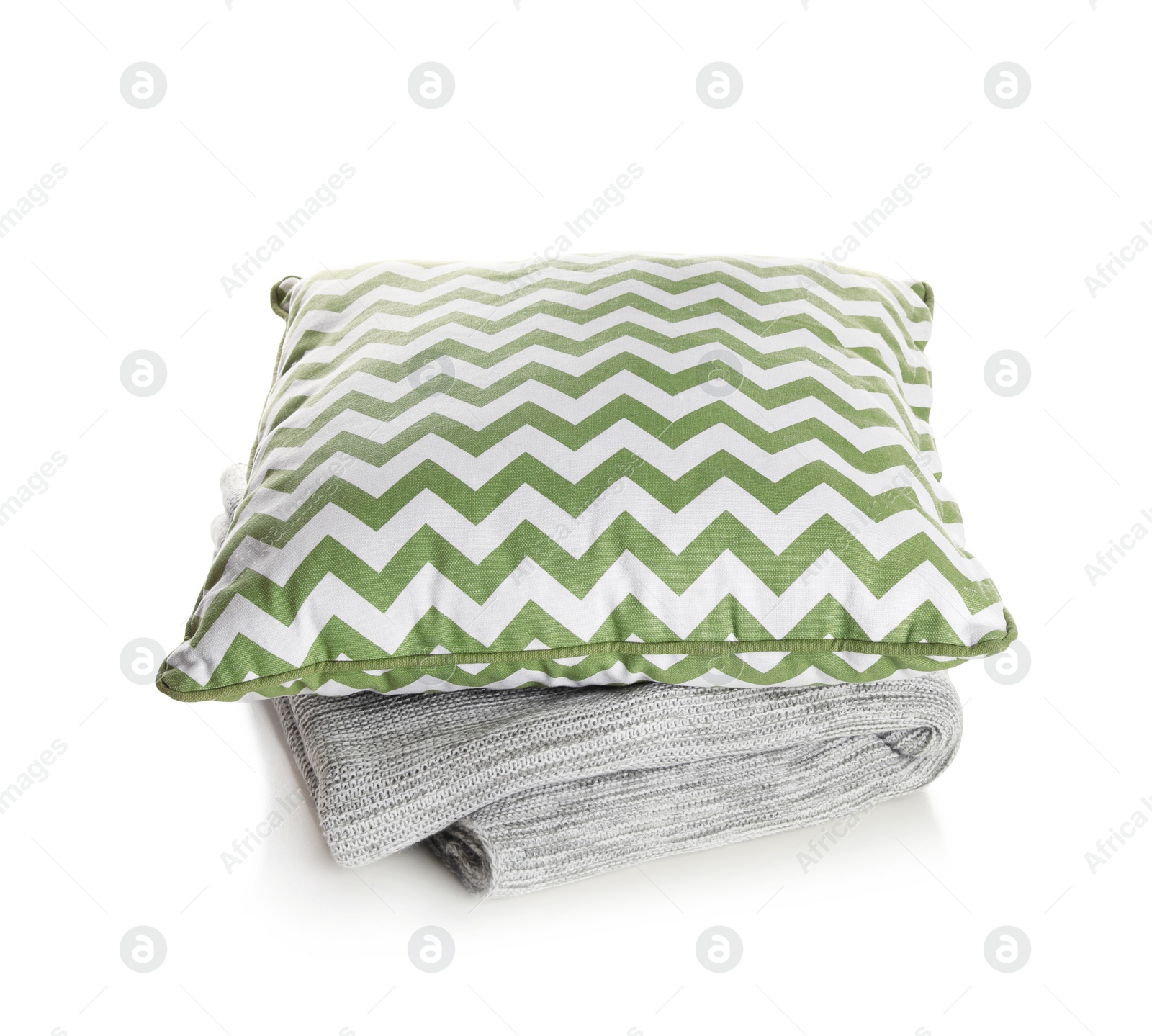 Photo of Stylish soft pillow and folded plaid on white background