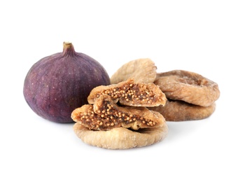 Photo of Tasty dried and raw figs on white background