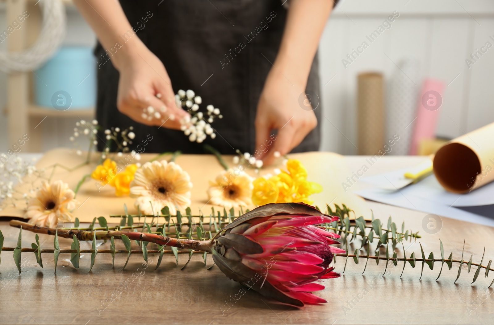 Photo of Beautiful flower and blurred florist on background