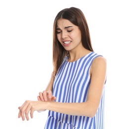 Photo of Young woman scratching arm on white background. Annoying itch