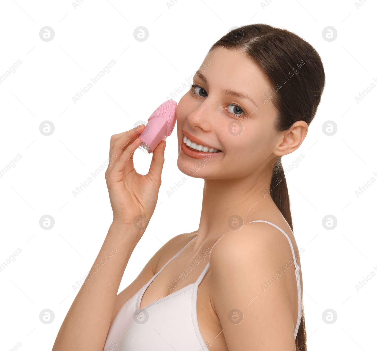 Photo of Washing face. Young woman with cleansing brush on white background