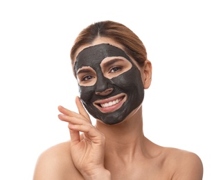 Photo of Beautiful woman with black mask on face against white background