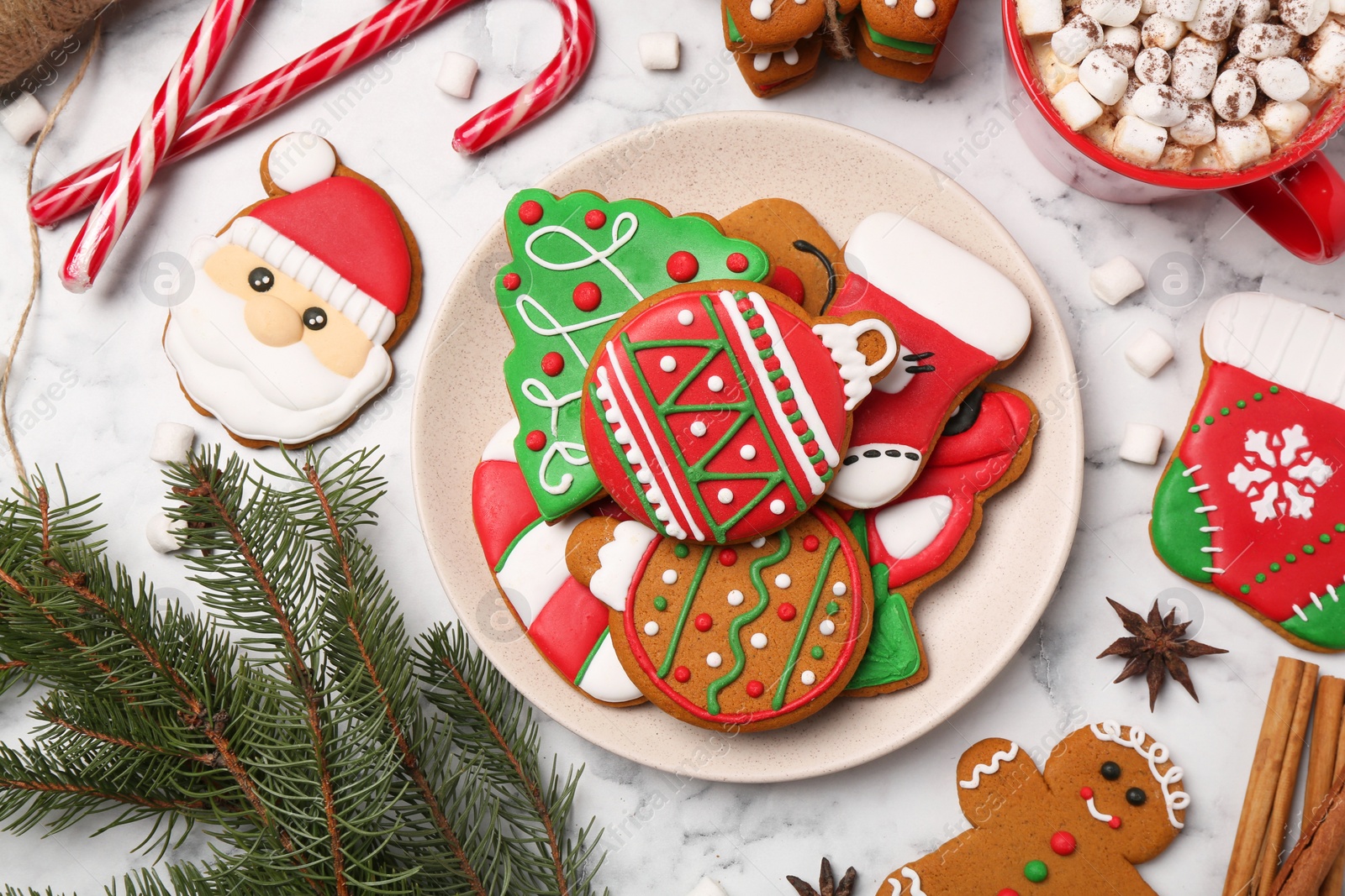 Photo of Flat lay composition with decorated Christmas cookies on white marble table