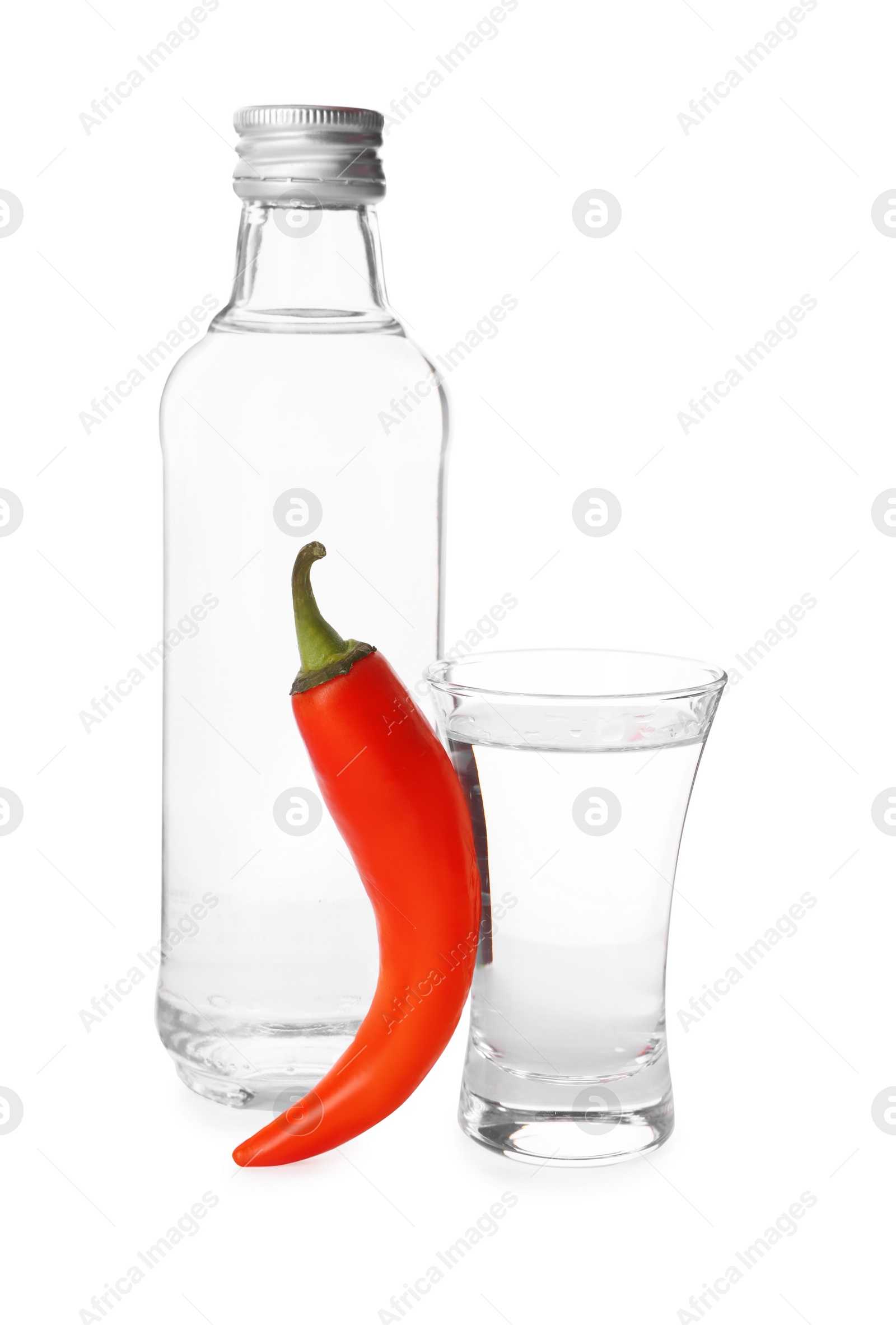 Photo of Red hot chili pepper and vodka on white background