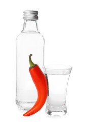 Photo of Red hot chili pepper and vodka on white background