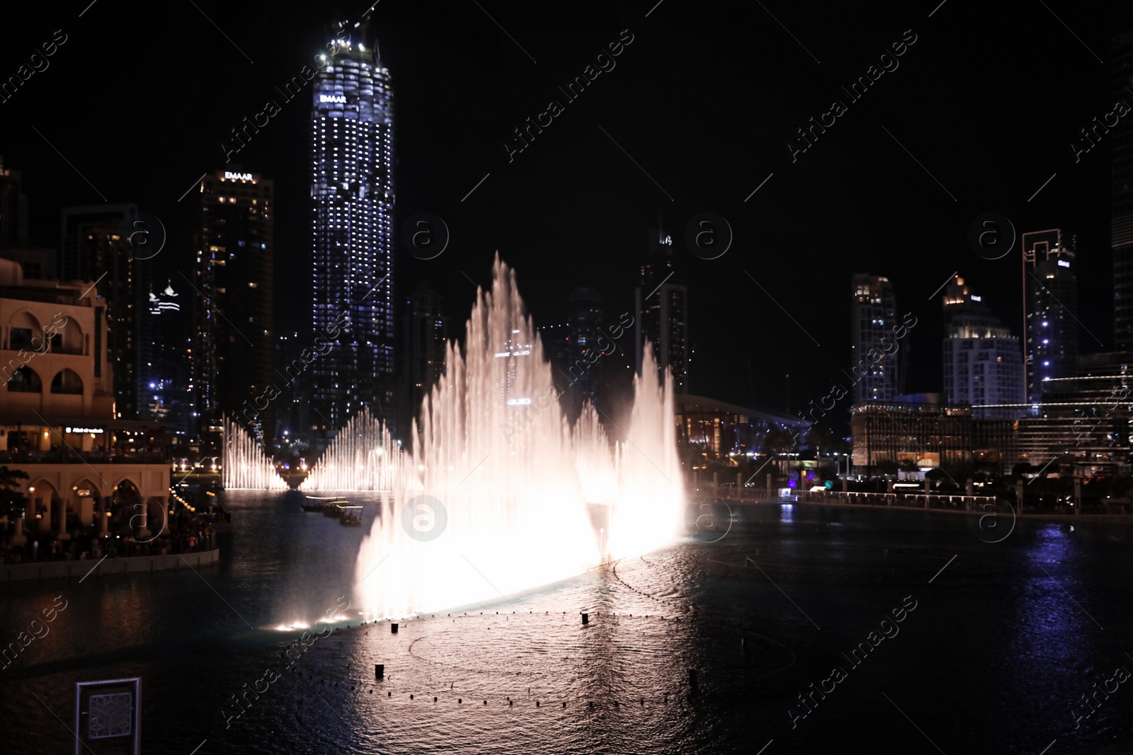 Photo of DUBAI, UNITED ARAB EMIRATES - NOVEMBER 04, 2018: Famous dancing fountain show on Burj Khalifa lake at night