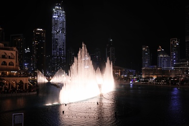 DUBAI, UNITED ARAB EMIRATES - NOVEMBER 04, 2018: Famous dancing fountain show on Burj Khalifa lake at night