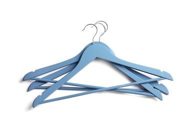 Photo of Empty clothes hangers on white background, top view