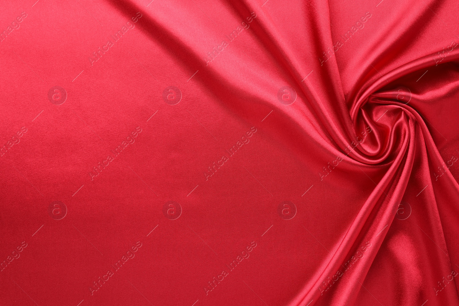 Photo of Texture of beautiful red silk fabric as background, closeup