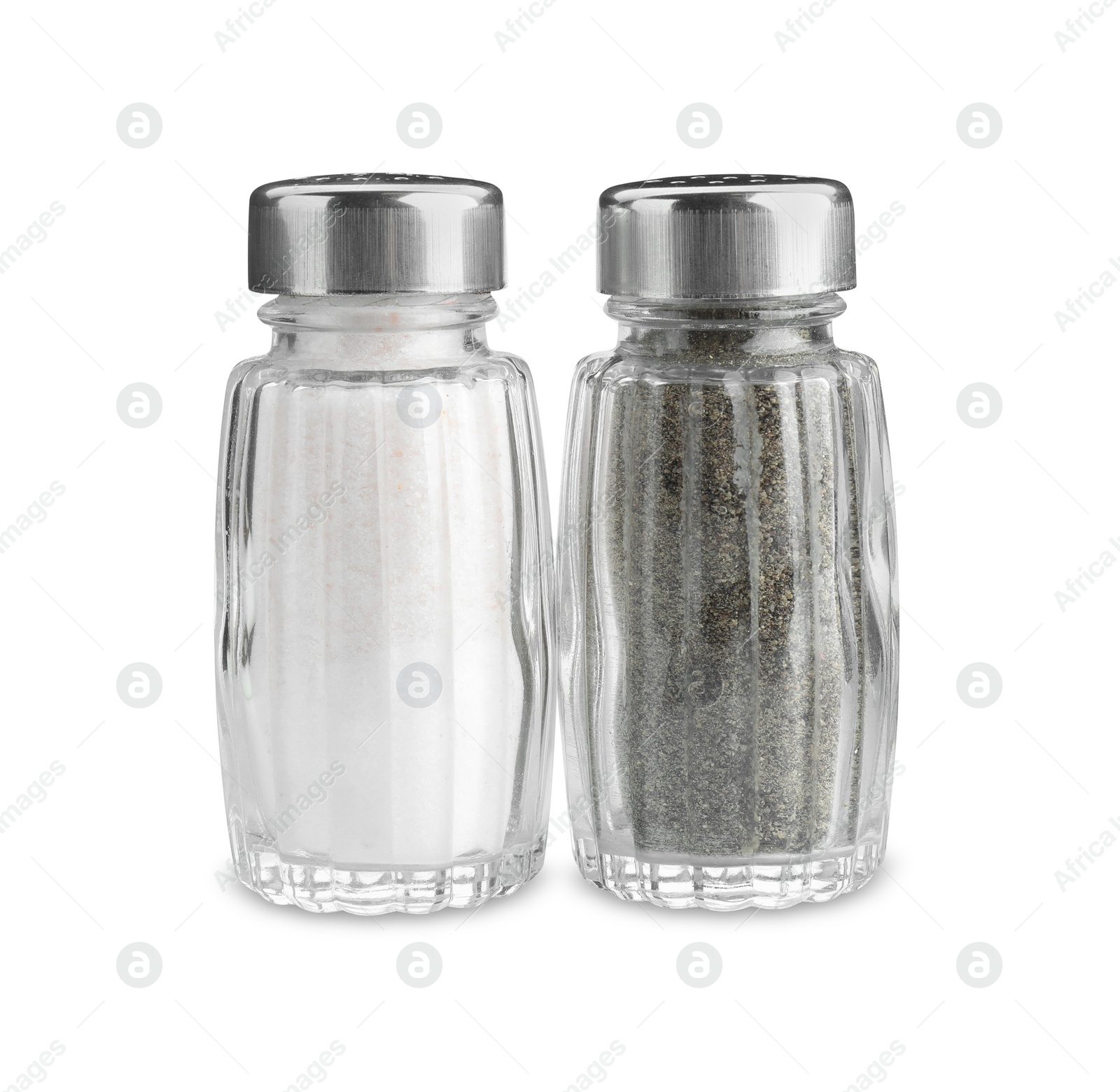 Photo of Salt and pepper shakers on white background