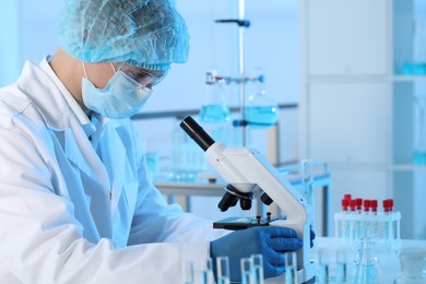 Photo of Scientist working with microscope in laboratory. Medical research