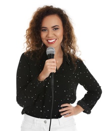 Curly African-American woman posing with microphone on white background