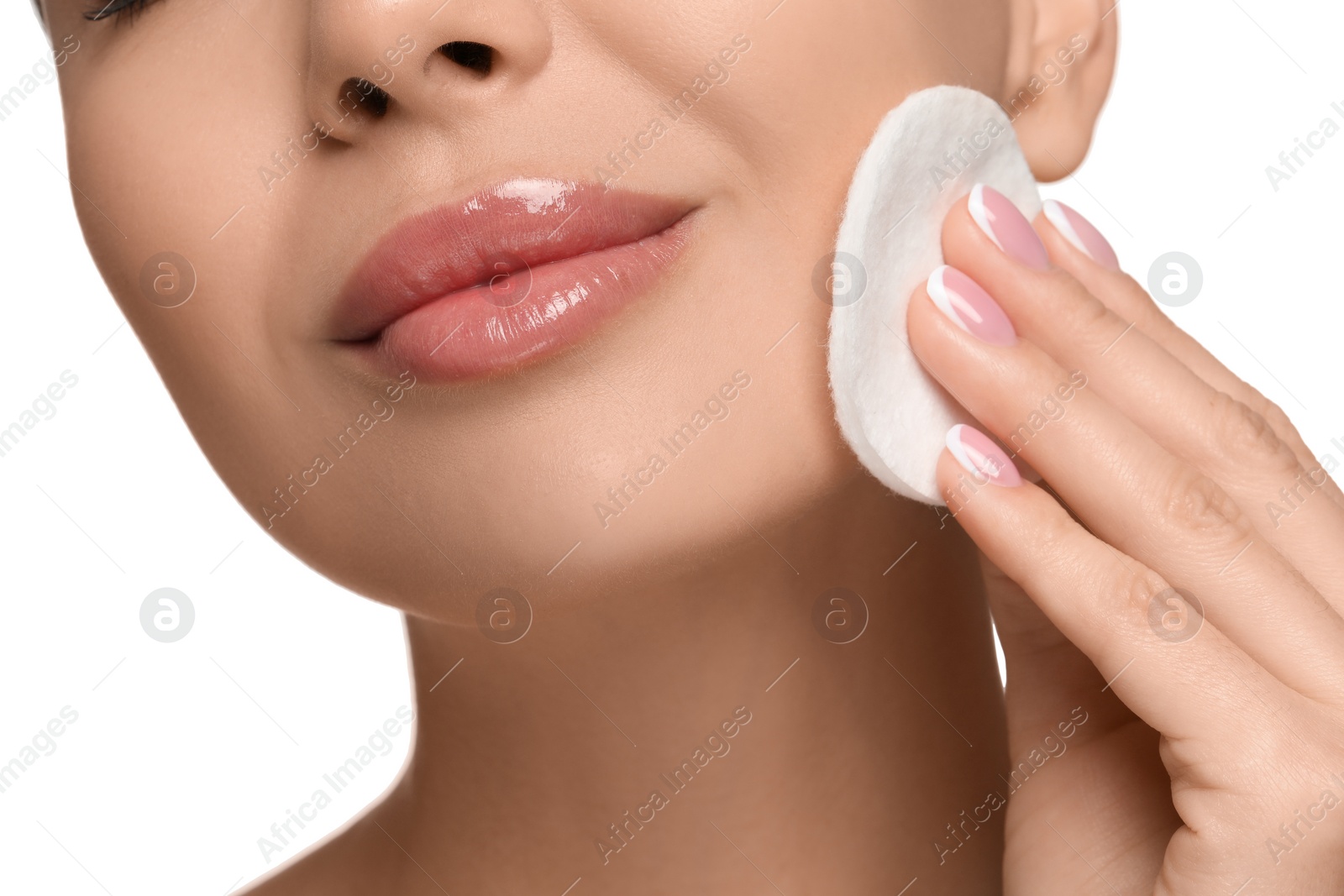 Photo of Beautiful woman removing makeup with cotton pad on white background, closeup