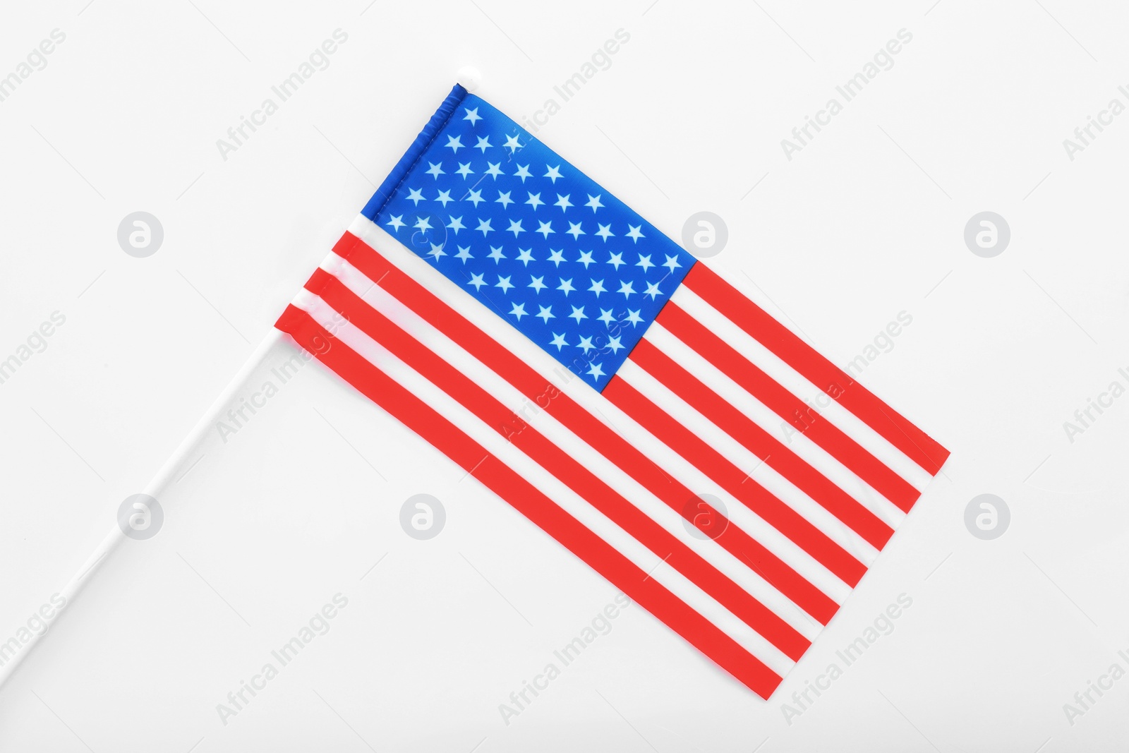 Photo of American flag on white background, top view