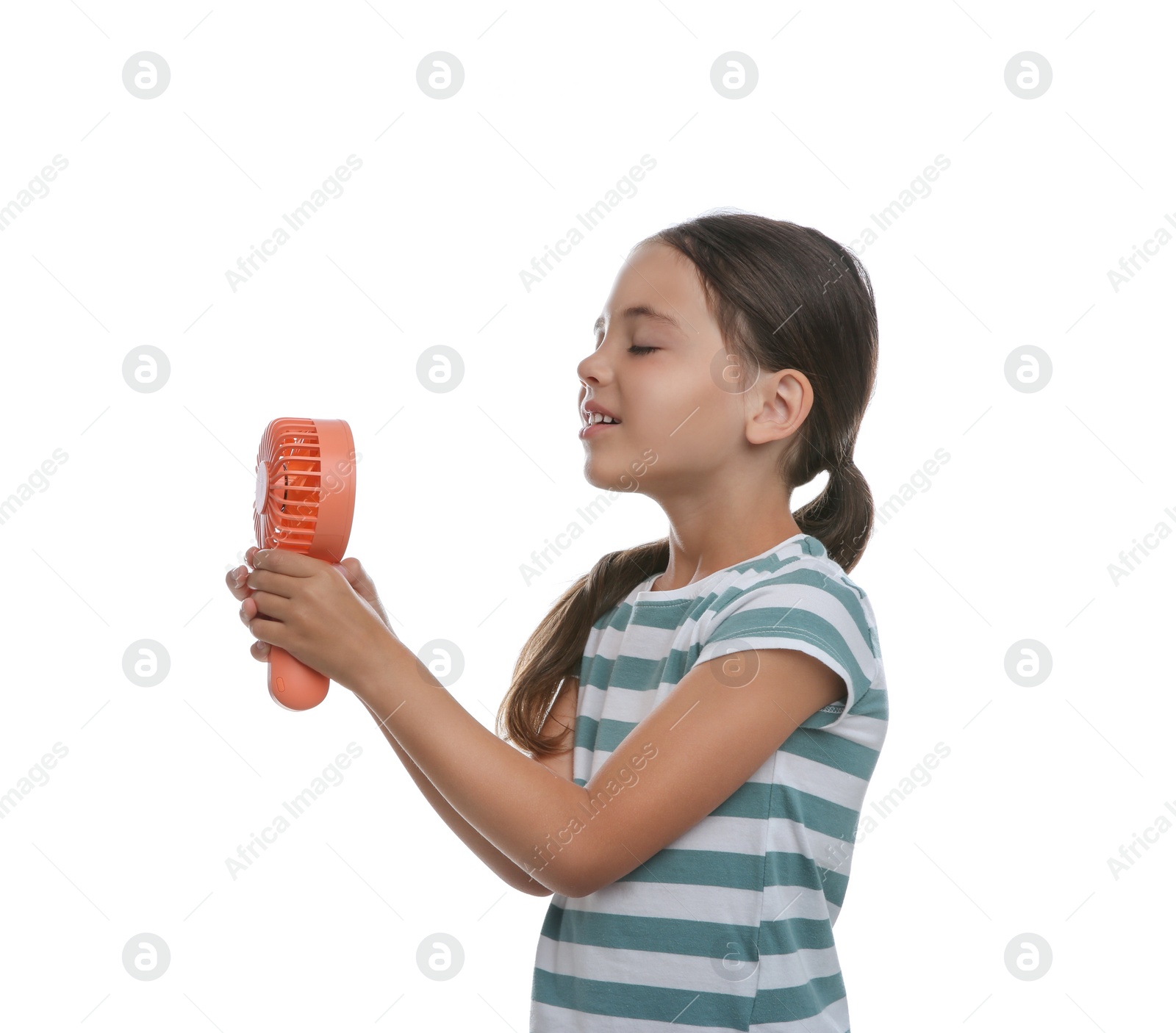 Photo of Little girl enjoying air flow from portable fan on white background. Summer heat