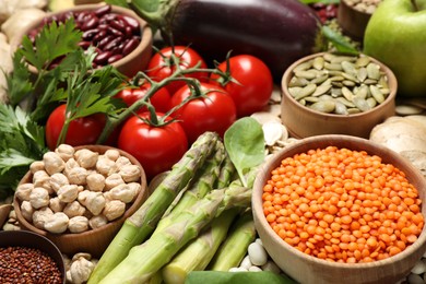 Different vegetables, seeds and fruits as background, closeup. Healthy diet