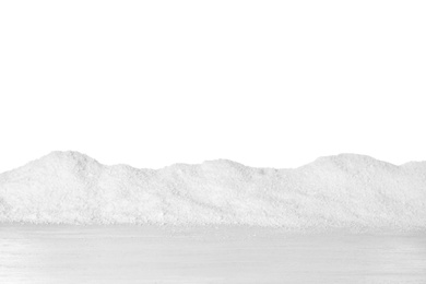 Photo of Heap of snow on wooden surface against white background