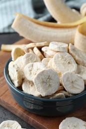 Photo of Freeze dried and fresh bananas on table, closeup