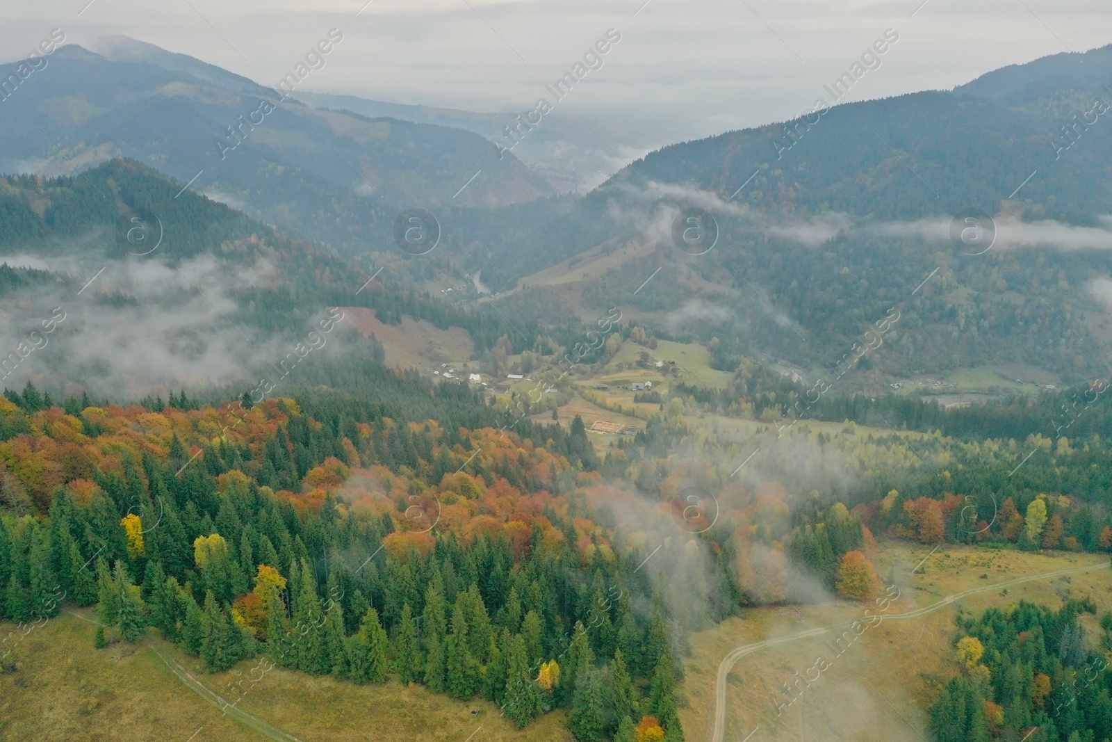 Photo of Aerial view of beautiful mountains on cloudy day