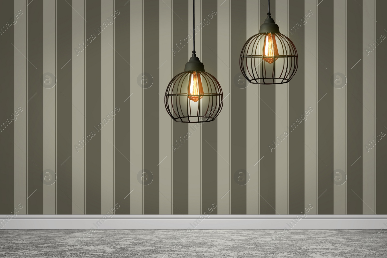 Image of Stylish pendant lamps hanging near striped wall in room