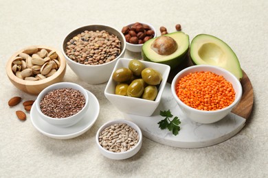 Photo of Different products high in natural fats on light table