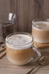 Cup of fresh coffee on wooden table