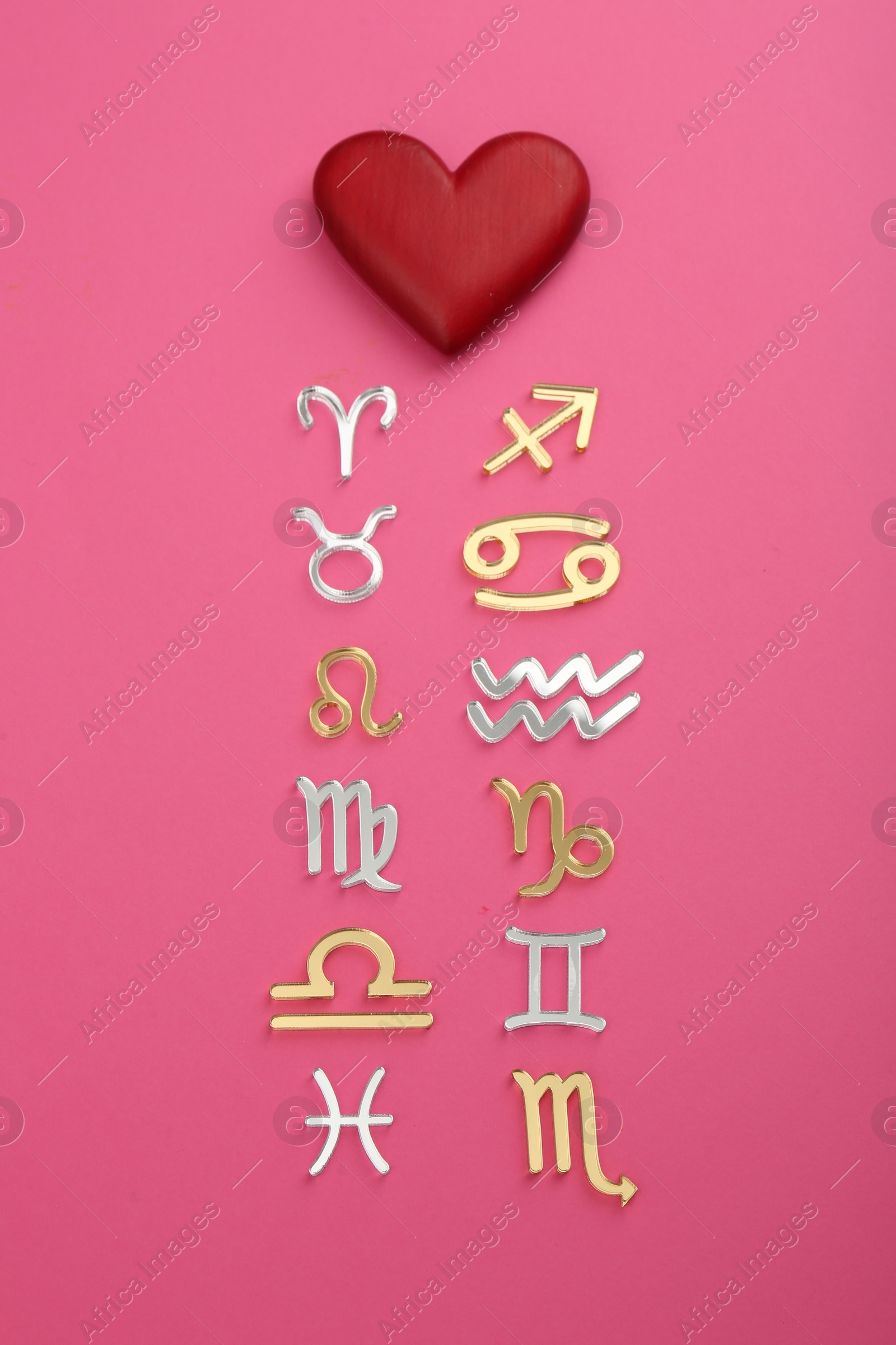 Photo of Zodiac compatibility. Signs with red heart on pink background, flat lay