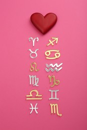 Photo of Zodiac compatibility. Signs with red heart on pink background, flat lay