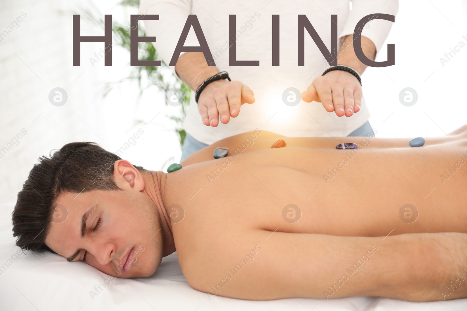 Image of Man during crystal healing session in therapy room