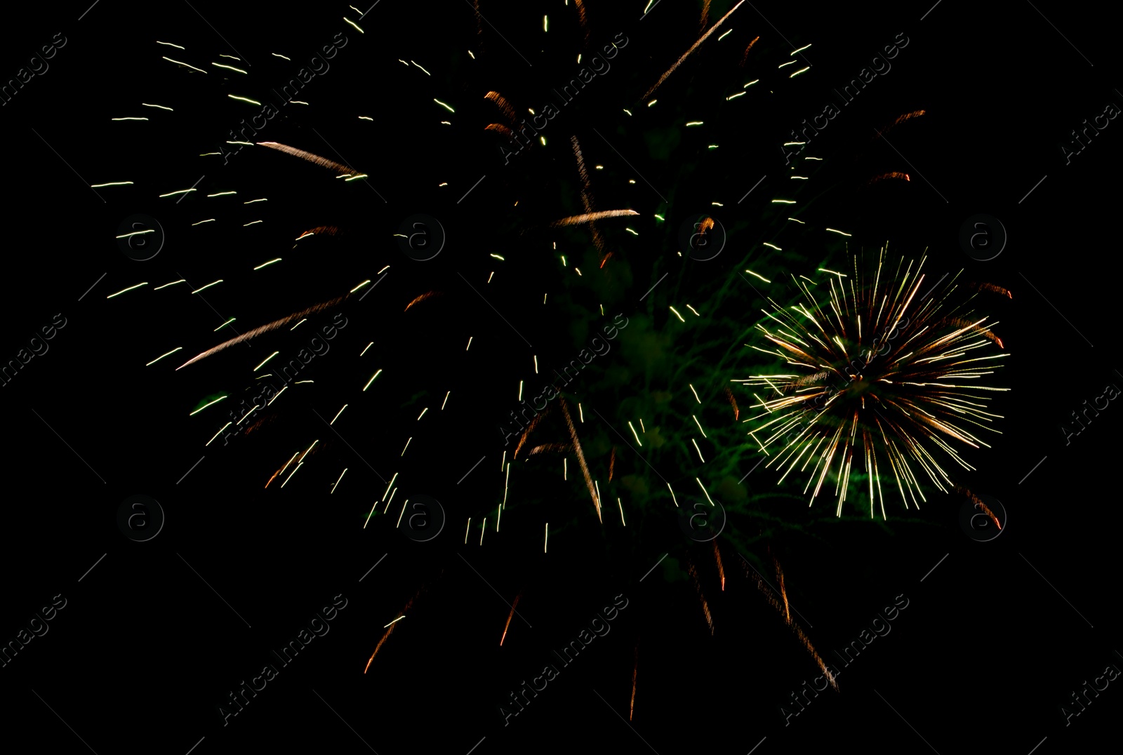 Image of Beautiful bright fireworks lighting up night sky