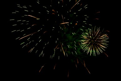 Image of Beautiful bright fireworks lighting up night sky