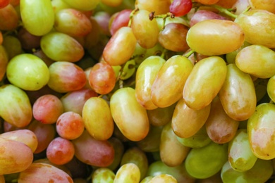Fresh ripe juicy grapes as background, closeup view