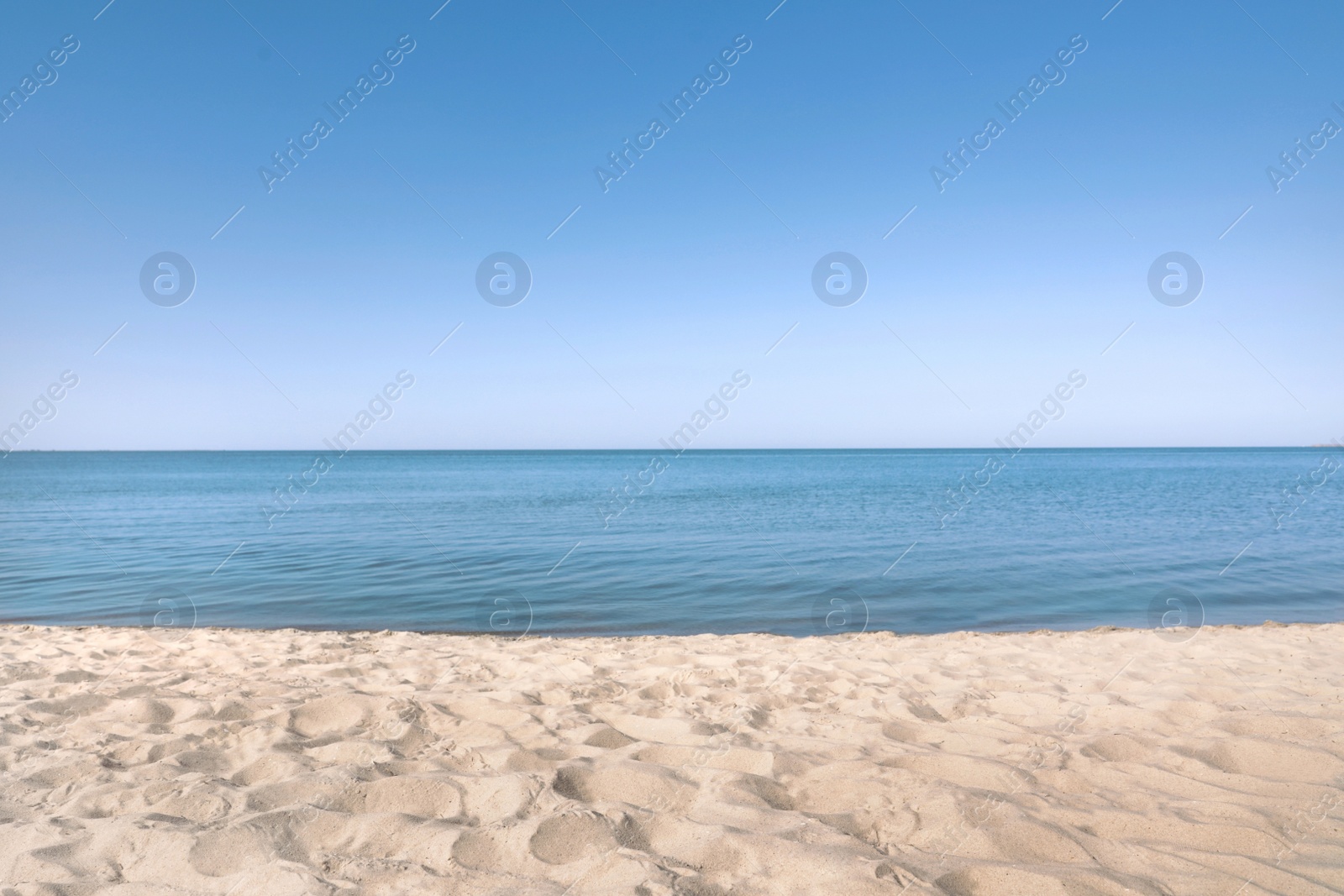 Photo of Sandy beach near sea on sunny summer day