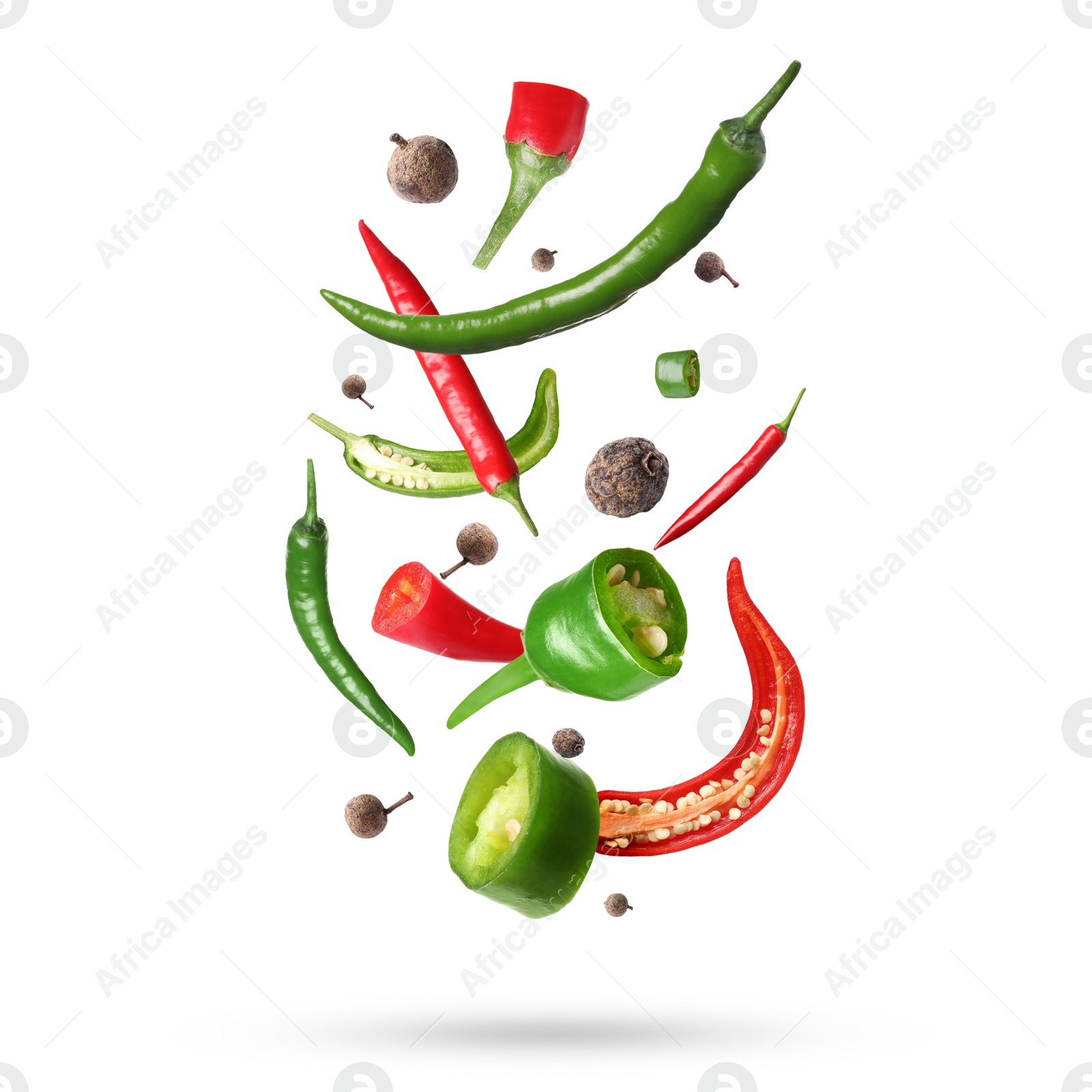 Image of Different aromatic spices falling on white background