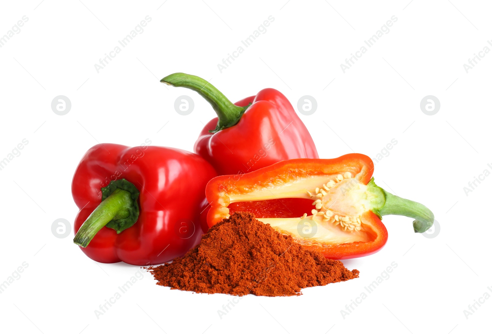 Photo of Fresh bell peppers and paprika powder on white background