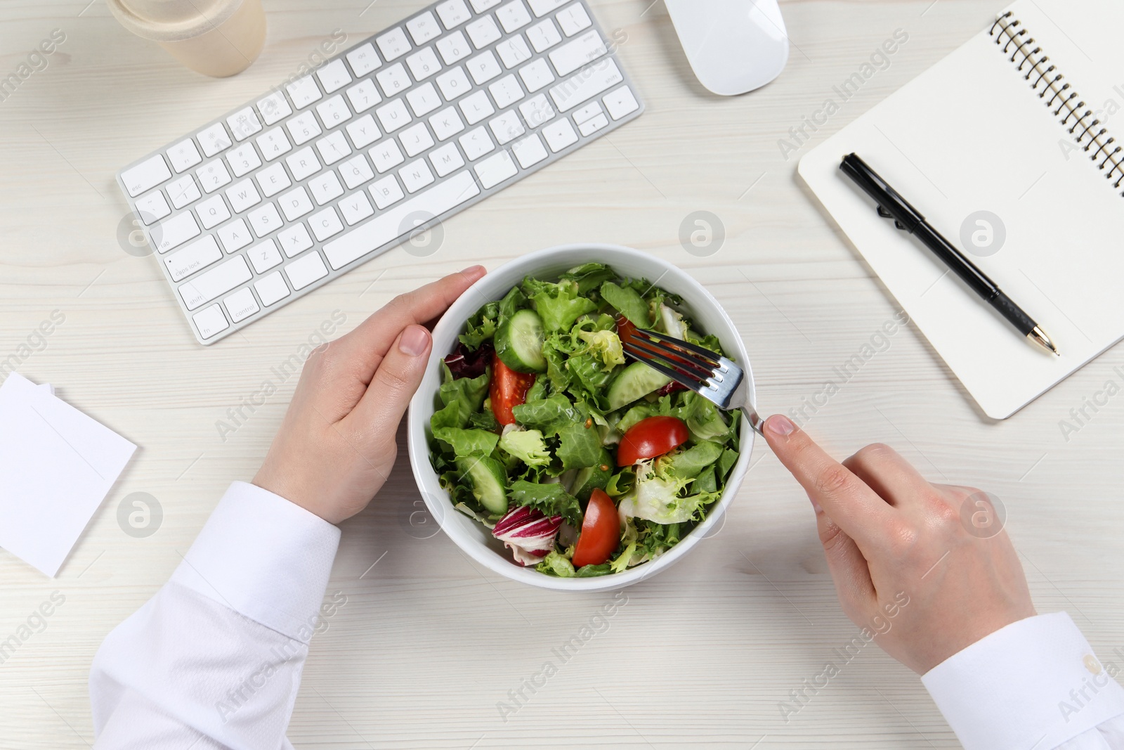 Photo of Office employee having business lunch at workplace, top view