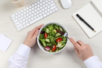 Photo of Office employee having business lunch at workplace, top view