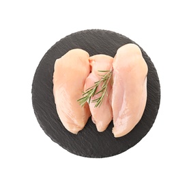 Photo of Slate plate with raw chicken breasts and rosemary on white background, top view. Fresh meat